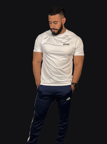 Jogger con franjas blancas a los costados y puño en la bota deportivo ADIDAS azul oscuro