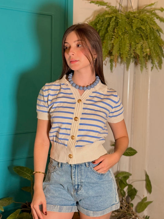 Top tipo chaleco tejido blanco con lineas azules