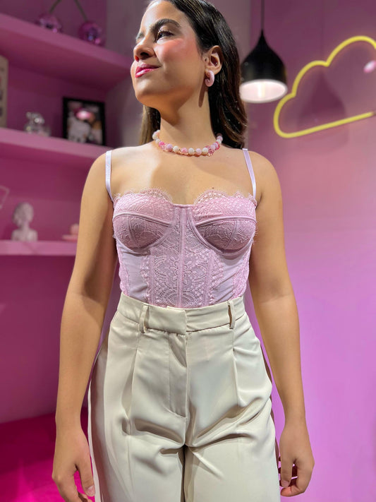 Corset de encaje rosa pastel
